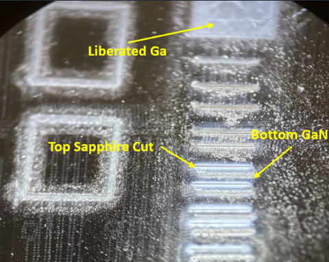 Laser marks on the die — liberated Ga from GaN ablation vs. the whiter top-surface sapphire cuts